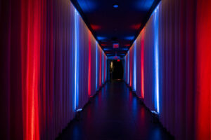 red and blue uplit hallway for nascar event